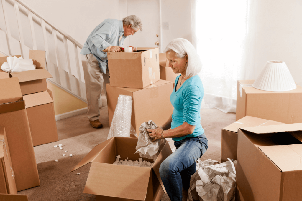 Older Couple Packing Boxes